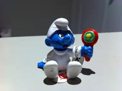 Smurfs - New Baby Smurf Holding a Rattle Toy, View more