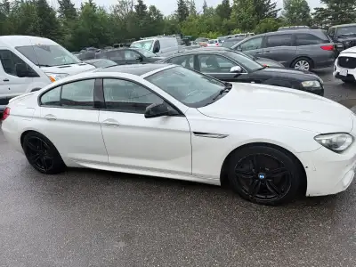 This 2014 BMW 650i Grand Coupe offers a powerful driving experience with its V8 engine and refined l...