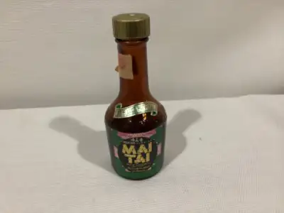 In excellent condition with original cap and partial tax seal. Back label has MAI-TAI recipe and Haw...