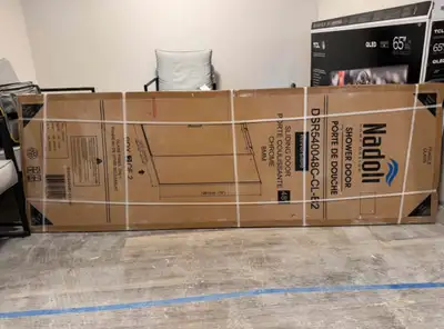Je vends une porte de douche neuve de la marque Nadoli modele Olympus pour cause de hauteur trop gra...