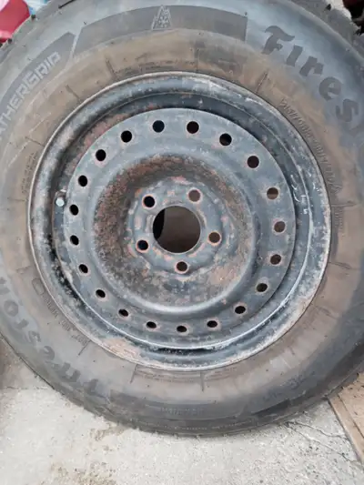 Set of 4 winter tires with rims. Firestone Weathergrip 215/70R15. Lots of tread, just no longer have...