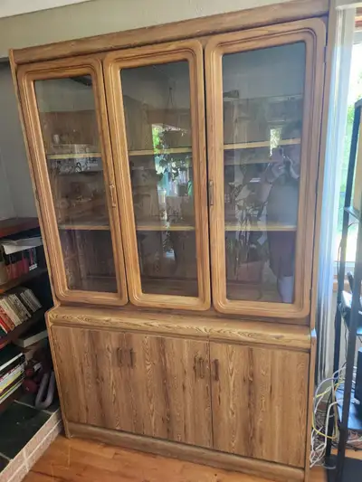 Beautiful display/storage cabinet. Top and bottom come apart for easy transport. Top has a backlight...