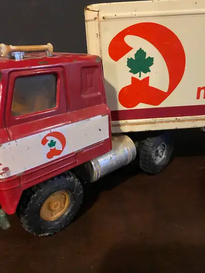 I'm offering a vintage Nylint semi-truck and trailer, a true blast from the past, showcasing a red c...