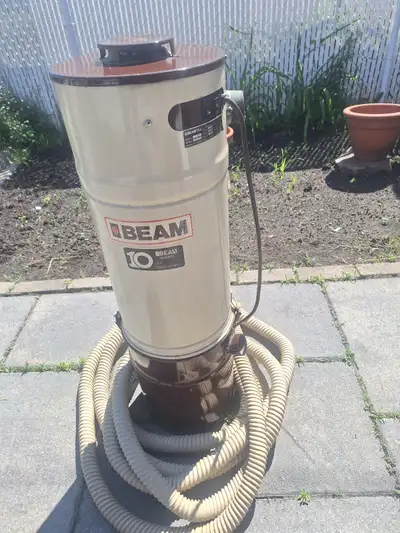 Central vacuum with hose. Needs a new dust bag,besides that it works great