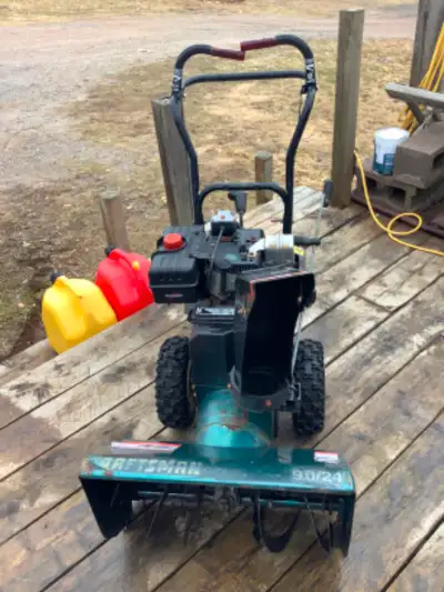 Craftsman snowblower no longer needed it is too small for my use. Runs and blows but it is stuck in...