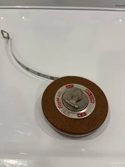 Vintage Evans & Co tape measure. 50 foot Works smoothly. In great condition. A little scuff at the 2...
