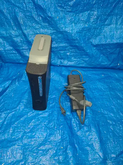 Xbox 360 Elite. Comes with power Cable and 20gb hard drive!, View more