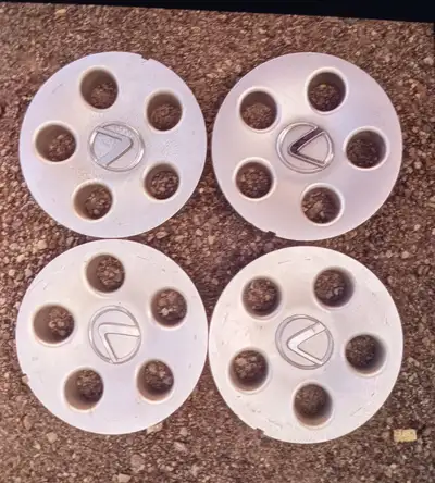 4 original hard to find wheel caps for your early lexus sedan.. $80 for all 4