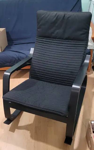 Selling a gently used IKEA Poäng rocking chair with black cushion and black frame. Bought about 5 ye...