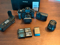 Fujifilm X-T2 body or Fuji XF 35 F2 and 18 F2