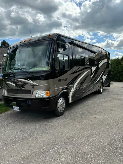 2013 Thor Outlaw Toyhauler and 2011 smart car convertible. Triton V10 gas. Coach in excellent condit...