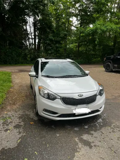 2014 Kia Forte New tires, runs great. Power windows, sun roof, leather interior, comes with four win...