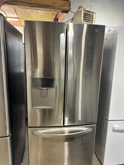 This is a used LG refrigerator, designed with a French door configuration and a convenient bottom fr...