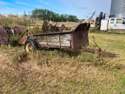 Antique John Deere manure spreader for sale, as is. Collector item. Should be restored.