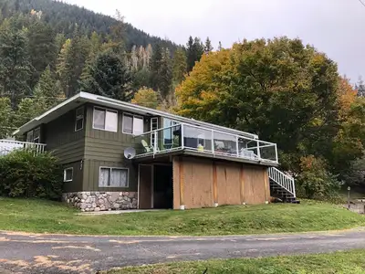 Lake home at one-mile with beautiful view of Kootenay Lake. Upstairs has three bedrooms, one full ba...