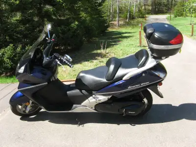 comes with helmet, full maintenance manual, new battery , Extra luggage carrier, Price when new $794...