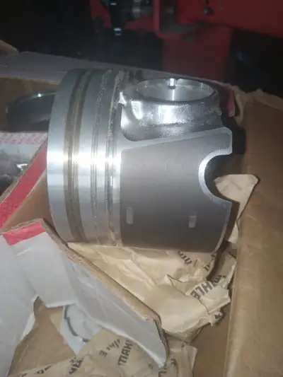New Mahle #224-3666 pistons and pins. These are 0.50 mm. oversize (0.020" oversize) and are still in...
