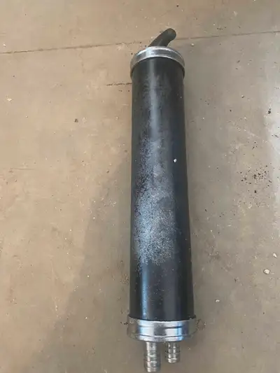 I am selling a used fuel filter, perfect for automotive enthusiasts. The photos show the item's cond...