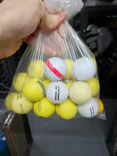 BAG OF ONLY SLIGHTLY USED GOLF BALLS, View more