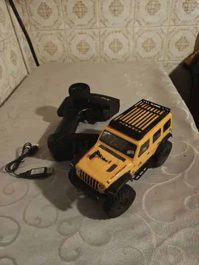Selling my Axial SCX24 rock crawler. Was barely used, comes with upgraded shocks, roof rack and slid...