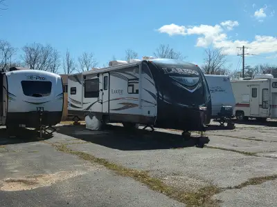 A/C, 3 power vents, 2 propane tanks 2 yrs. old, microwave, propane/electric/12 V. fridge, plenty of...