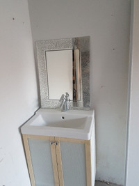 Clean Vanity with mirror and faucet