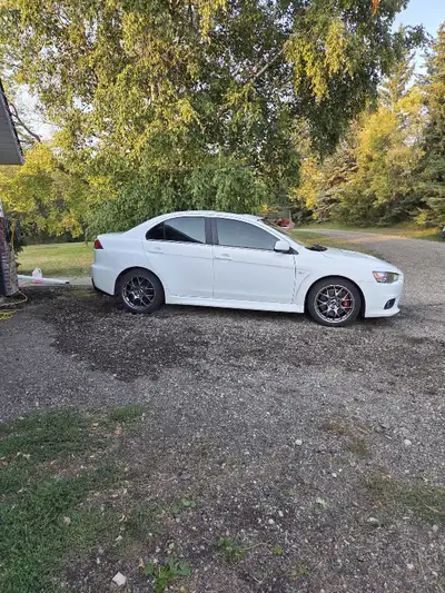 Stock evo 10 Original rims Navi plus Bluetooth Paddle Shifting Leather heated seats Sunroof