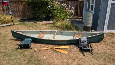 14' fiberglass canoe. Includes 2 wooden paddles and 2 padded seat backers Light weight and easy to p...