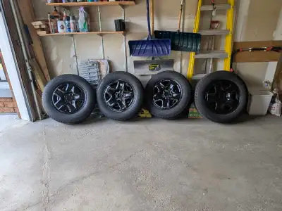 Selling a set of 225/65R17 alloy rims. Tires around 4.5mm (6/32nds), selling mainly for rims. Came o...