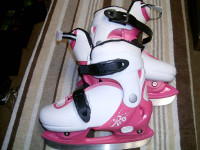 FOR SALE ONE NEW PAIR OF GIRLS SKATES SIZE 12 ADJUSTABLE BOOTS