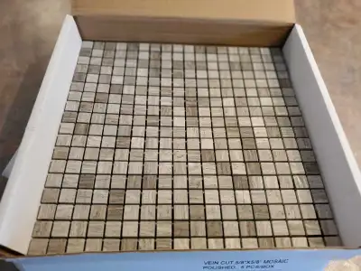 Selling 1' × 1' mosaic tiles. 5 tiles per box.$30 per box. 3 boxes to sell.