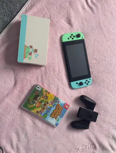 Perfect condition Animal Crossing themed Nintendo Switch gaming console with charger, controller hol...