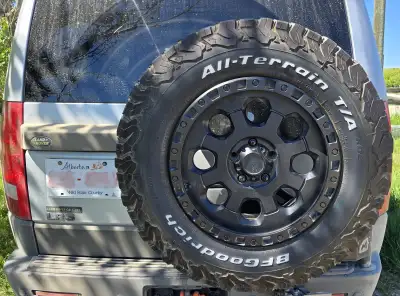 Full set o BF Goodrich All Terrain T/A KO2 tires, LT275/70 R18. Without a tread gauge, perhaps 50-60...