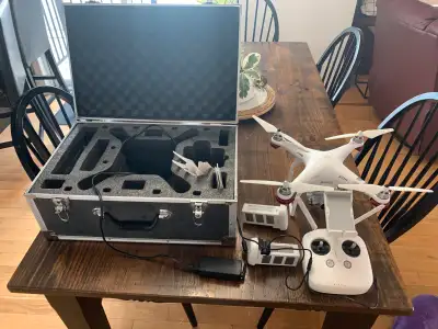 Low use Complete with phanton 3 adv drone, carry case, 2 batteries, charger, and spare propellers. E...
