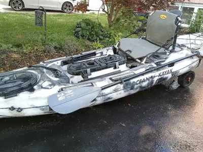 I'm selling a used Ocean Kayak fishing kayak that's ready for the water, equipped with a comfortable...
