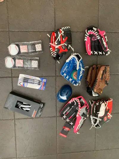 I have a selection of baseball gloves including Rawlings and Mizuno, along with Toronto Blue Jays me...