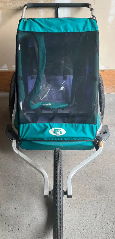 In Good Condition Double Chariot for tow kida with bike trailer kit.