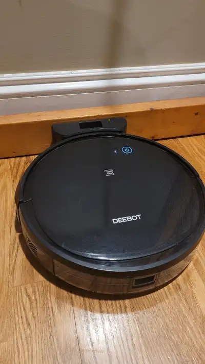A 3 year-old robot vacuum cleaner, scuffed up but otherwise in perfect working condition (we still r...