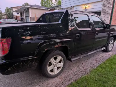 2010 Honda Ridgeline passenger side wheel wells, and lift gate rust, check engine been on since 275...