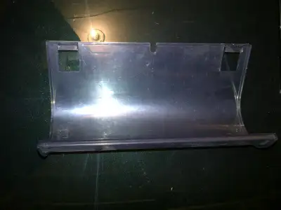 Wine bottle holder for Amana fridge Clips to side Can possibly be used for other makes Holds a wine...