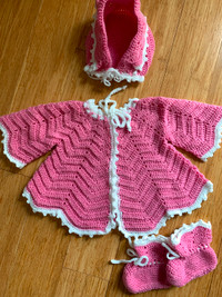 Beautiful crochet rose Baby cardigan with bonnet and socks.