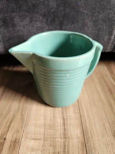 Vintage Monmouth Pottery pitcher for sale. Teal colour with ribbed pattern along the side. Made in U...