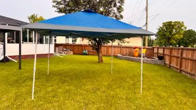Selling a like new 12' X 12' easy pop up canopy tent, with blue and grey trimmed canopy. It comes wi...