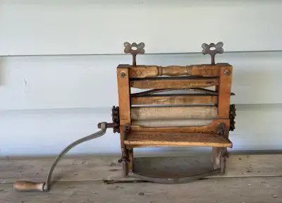 These vintage rubber wringer washer rollers were manufactured by Paragon and are housed in a wooden...