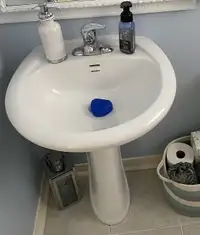 White porcelain pedestal bathroom sink