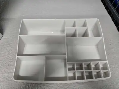 This used cosmetic organizer features multiple compartments for various items. It's a great way to k...