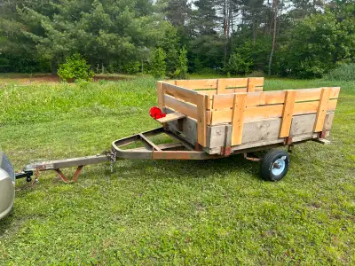 4'8" X 6'8" utility trailer. Made to haul snow blowers and riding lawn mower circa 2018. Metal frame...
