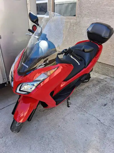 2016 Honda Forza 300 CC 4,318km Comes with 2 Zox Helmets and 2 half cans. All helmets fit in the bac...