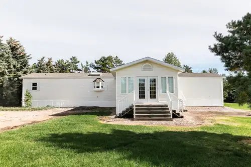 This well-maintained 1990 modular home is move-in ready and offers excellent value with two spacious...