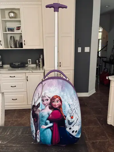 I'm offering a Disney Frozen rolling luggage, perfect for your little one's travels. This is not a n...